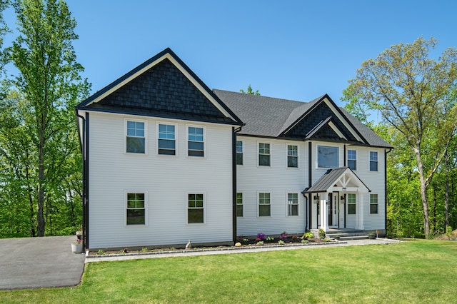 26 Hunting Ridge Rd, Brookfield, CT 06804 - view of front of home featuring a front lawn and roof with shingles