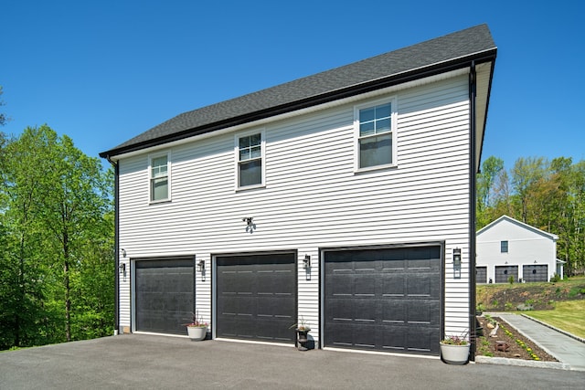 26 Hunting Ridge Rd, Brookfield, CT 06804 - view of property exterior featuring an attached garage and driveway