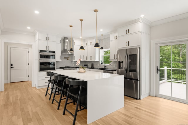 26 Hunting Ridge Rd, Brookfield, CT 06804 - kitchen with appliances with stainless steel finishes, wall chimney exhaust hood, a sink, backsplash, and a kitchen breakfast bar