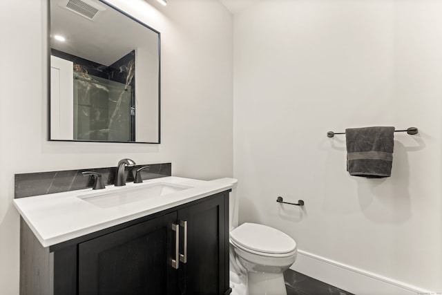 26 Hunting Ridge Rd, Brookfield, CT 06804 - full bathroom with vanity, toilet, marble finish floors, and a shower