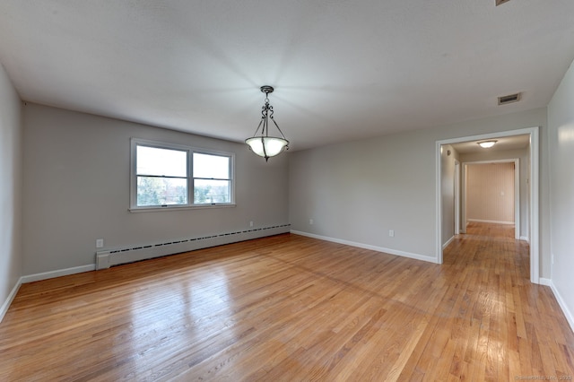3 Clear View Dr, Mansfield, CT 06250 - empty room featuring a baseboard heating unit, light wood finished floors, and baseboards