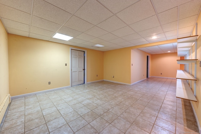 3 Clear View Dr, Mansfield, CT 06250 - empty room featuring a baseboard heating unit, a drop ceiling, light tile patterned floors, and baseboards