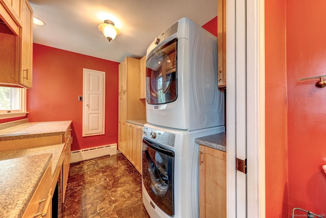 3 Clear View Dr, Mansfield, CT 06250 - laundry area featuring a baseboard radiator, stacked washer / drying machine, cabinet space, dark marble finish flooring, and baseboards