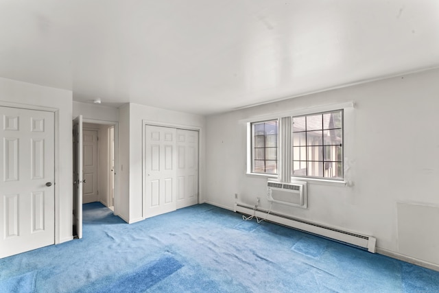 50 Aiken St Apt 465, Norwalk, CT 06851 - unfurnished bedroom featuring baseboard heating, a wall unit AC, carpet floors, a closet, and baseboards