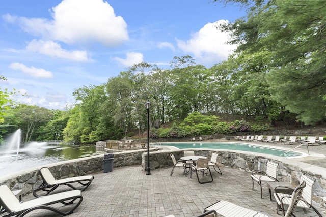 50 Aiken St Apt 465, Norwalk, CT 06851 - view of patio / terrace with a community pool and a water view