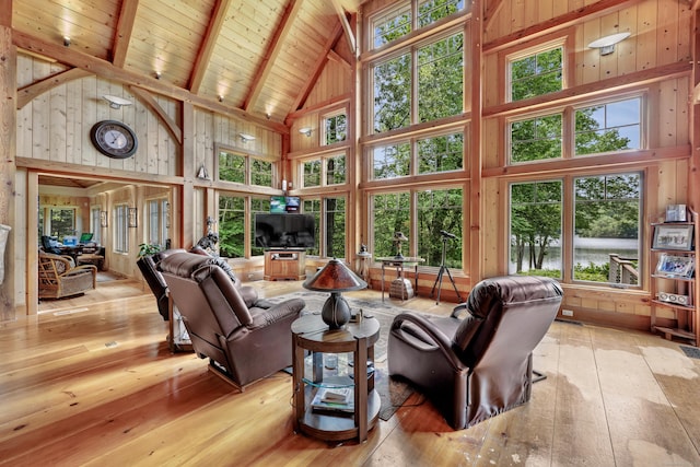 218 Kuhne Rd, Southbury, CT 06488 - living room featuring high vaulted ceiling, hardwood / wood-style floors, wood ceiling with exposed beams, and wood walls