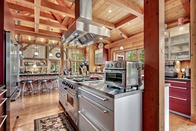 218 Kuhne Rd, Southbury, CT 06488 - kitchen featuring stainless steel countertops, island range hood, high end stainless steel range, wood ceiling with exposed beams, and light wood-type flooring