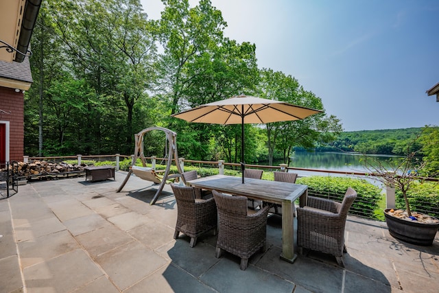 218 Kuhne Rd, Southbury, CT 06488 - view of patio / terrace with outdoor dining space, a water view, and a forest view