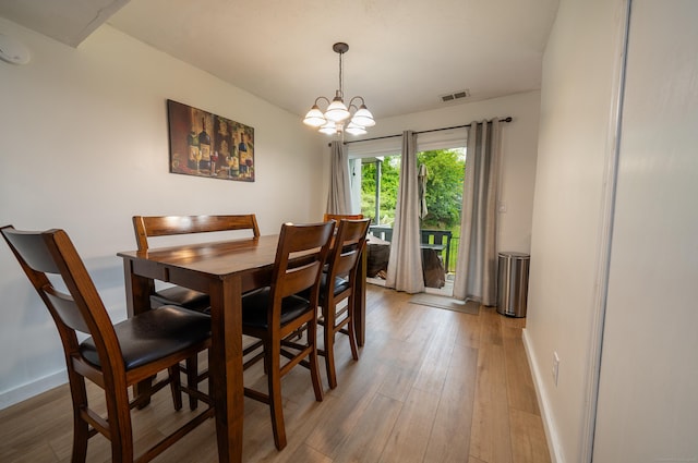 183 Thompson St Unit B, East Haven, CT 06513 - dining space featuring light wood-style floors, a chandelier, and baseboards