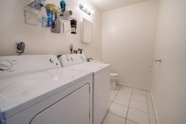 183 Thompson St Unit B, East Haven, CT 06513 - washroom with washer and clothes dryer, light tile patterned floors, and baseboards