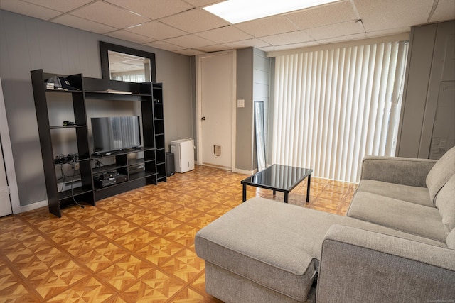 183 Thompson St Unit B, East Haven, CT 06513 - living room featuring a paneled ceiling and baseboards