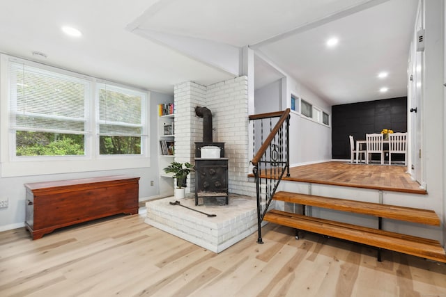 35 Old Acres Rd, East Haddam, CT 06469 - staircase featuring baseboards, wood finished floors, a wood stove, and recessed lighting