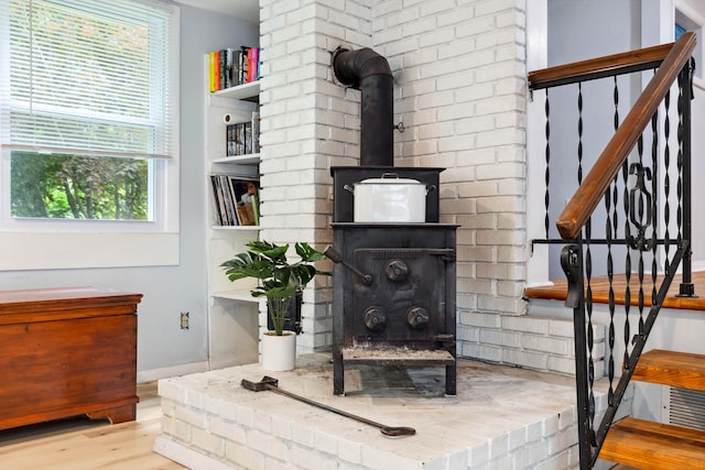35 Old Acres Rd, East Haddam, CT 06469 - detailed view of a wood stove, wood finished floors, and baseboards