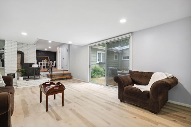 35 Old Acres Rd, East Haddam, CT 06469 - living room featuring a wood stove, light wood-style flooring, baseboards, and recessed lighting