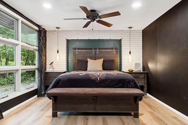 35 Old Acres Rd, East Haddam, CT 06469 - bedroom featuring wood finished floors, multiple windows, brick wall, baseboards, and recessed lighting