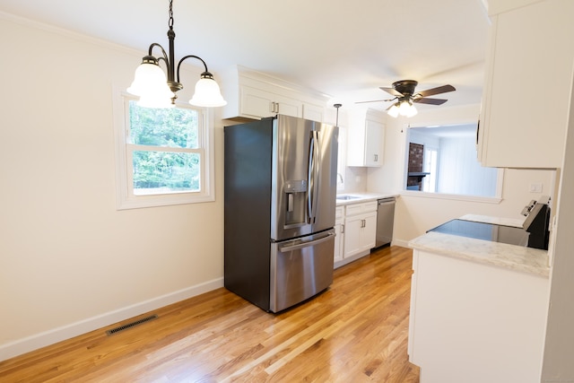 38 Dinwoodie Dr, North Branford, CT 06471 - kitchen featuring stainless steel appliances, ceiling fan, baseboards, white cabinetry, and light wood-style flooring