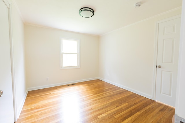 38 Dinwoodie Dr, North Branford, CT 06471 - spare room with light wood-type flooring, a smoke detector, crown molding, and baseboards