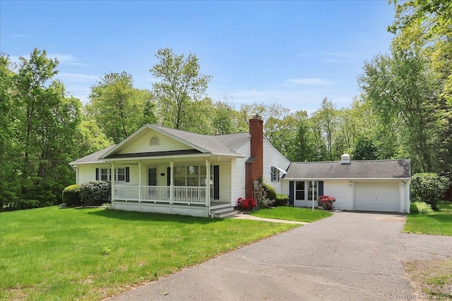 166 Mine Rd, Bristol, CT 06010 - view of front facade featuring driveway, covered porch, and a front lawn