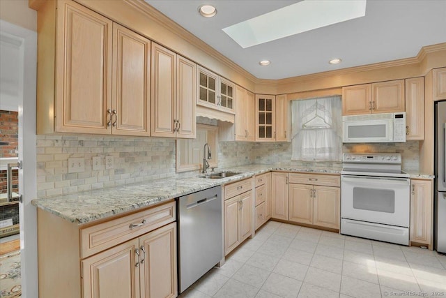 166 Mine Rd, Bristol, CT 06010 - kitchen featuring appliances with stainless steel finishes, a sink, light brown cabinetry, a skylight, and crown molding
