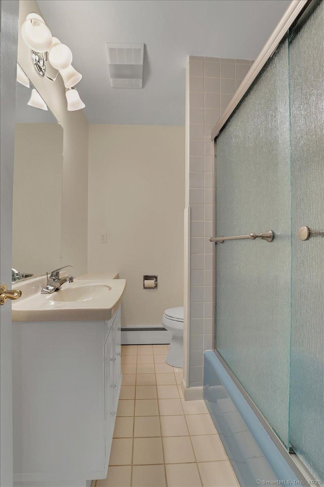 166 Mine Rd, Bristol, CT 06010 - bathroom with baseboard heating, tile patterned flooring, toilet, vanity, and baseboards