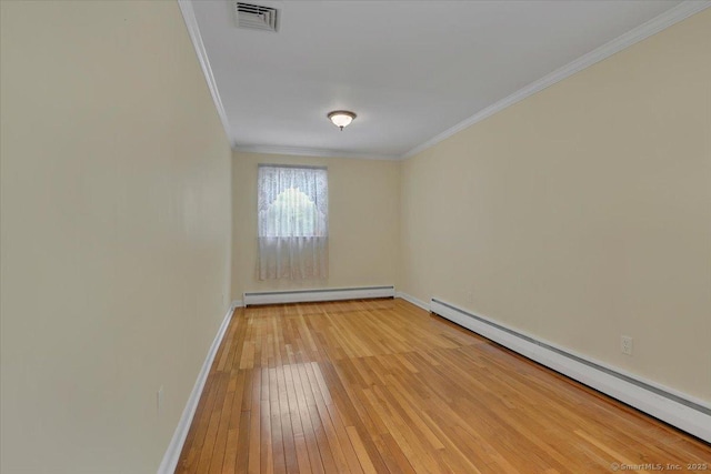 166 Mine Rd, Bristol, CT 06010 - unfurnished room with a baseboard heating unit, crown molding, light wood-style flooring, and baseboards