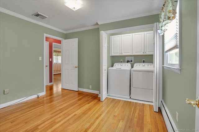 166 Mine Rd, Bristol, CT 06010 - washroom with cabinet space, baseboard heating, washer and dryer, light wood-style flooring, and crown molding