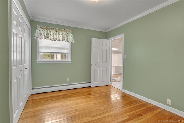 166 Mine Rd, Bristol, CT 06010 - unfurnished bedroom with baseboard heating, crown molding, light wood finished floors, a closet, and baseboards