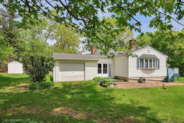 166 Mine Rd, Bristol, CT 06010 - view of front of property featuring an attached garage, a front yard, and a chimney