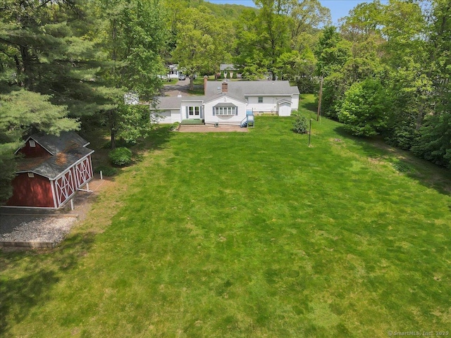 166 Mine Rd, Bristol, CT 06010 - back of property with a lawn and a view of trees