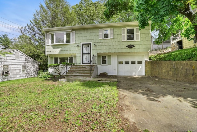 9 Marlin Dr, Norwalk, CT 06854 - split foyer home featuring asphalt driveway, a garage, and cooling unit