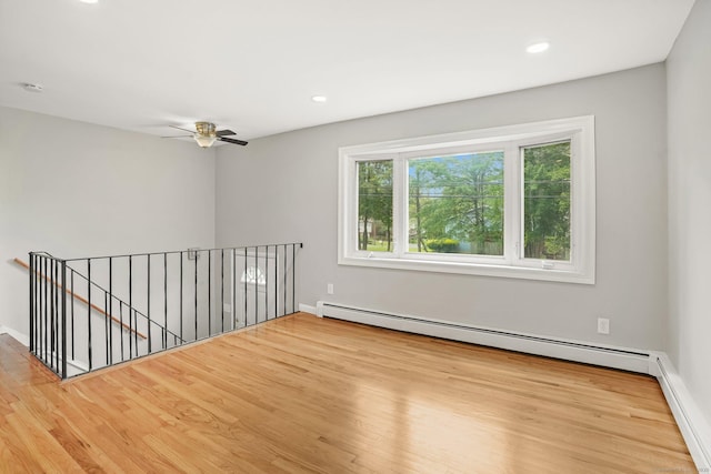 9 Marlin Dr, Norwalk, CT 06854 - empty room featuring wood finished floors, baseboards, recessed lighting, and baseboard heating