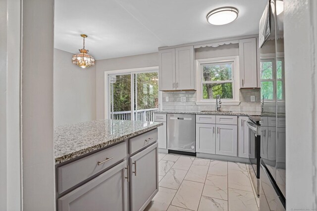9 Marlin Dr, Norwalk, CT 06854 - kitchen with appliances with stainless steel finishes, light marble finish flooring, plenty of natural light, and backsplash