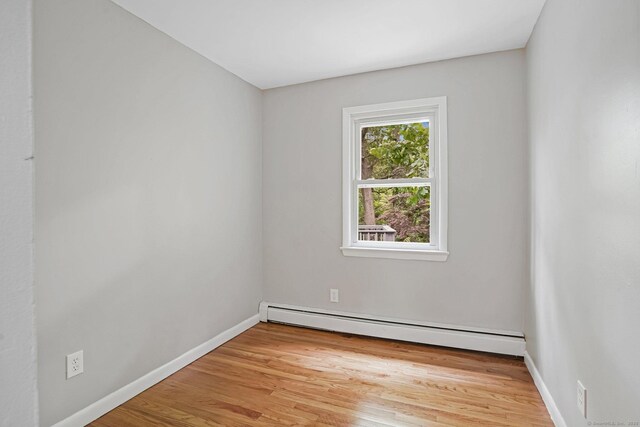 9 Marlin Dr, Norwalk, CT 06854 - spare room with a baseboard radiator, light wood finished floors, and baseboards