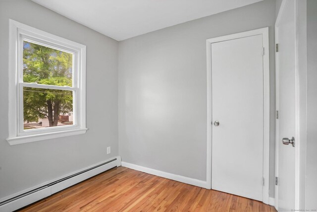9 Marlin Dr, Norwalk, CT 06854 - spare room featuring baseboard heating, light wood finished floors, and baseboards