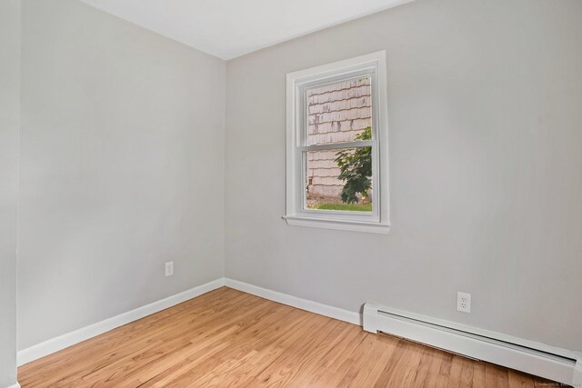 9 Marlin Dr, Norwalk, CT 06854 - spare room with baseboard heating, baseboards, and wood finished floors