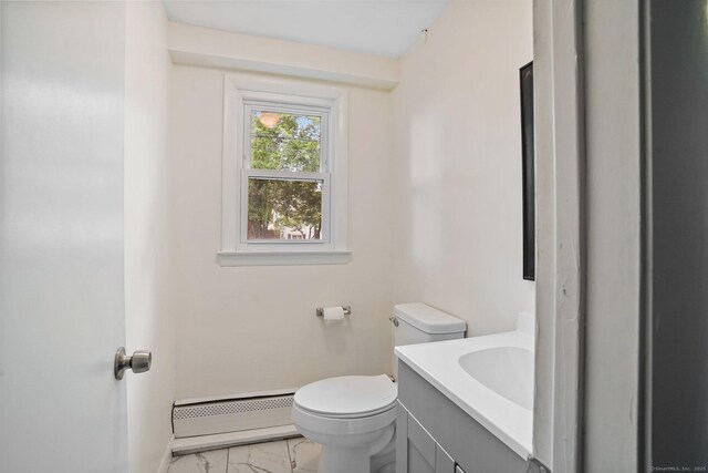 9 Marlin Dr, Norwalk, CT 06854 - half bath featuring marble finish floors, a baseboard heating unit, toilet, vanity, and baseboards