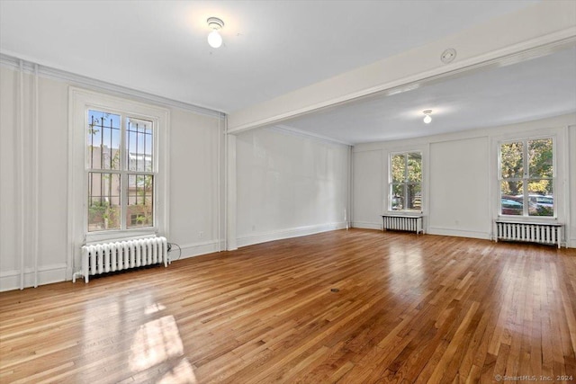 8 Academy St, New Haven, CT 06511 - unfurnished room featuring radiator, wood finished floors, baseboards, and ornamental molding