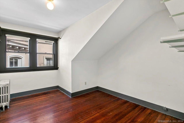 8 Academy St, New Haven, CT 06511 - additional living space featuring wood finished floors, radiator, vaulted ceiling, and baseboards