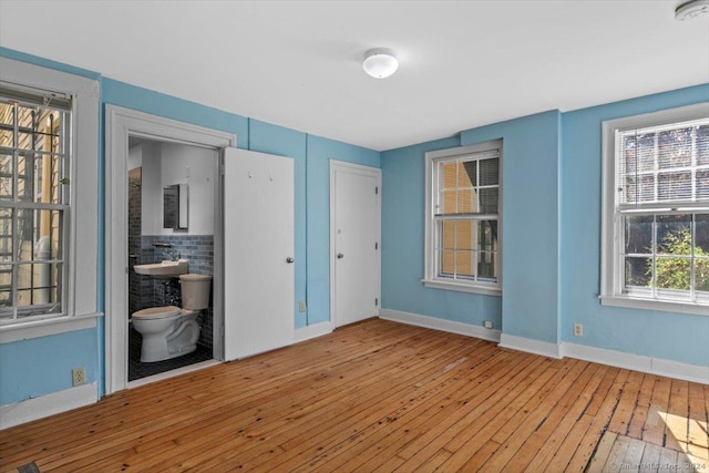 8 Academy St, New Haven, CT 06511 - empty room featuring wood-type flooring, baseboards, and a smoke detector