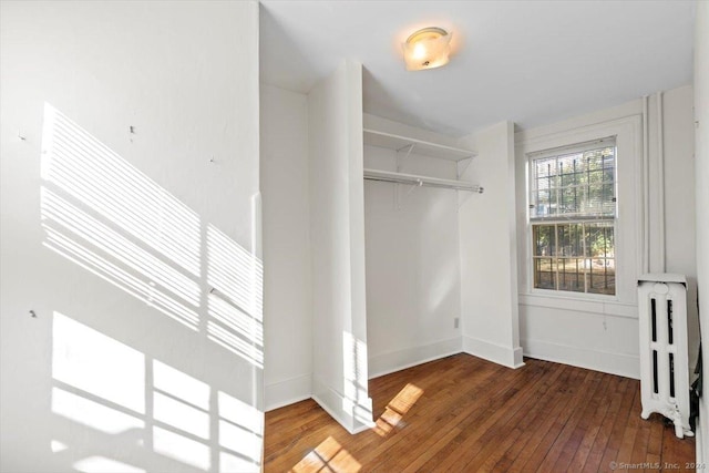 8 Academy St, New Haven, CT 06511 - spacious closet featuring radiator heating unit and hardwood / wood-style floors