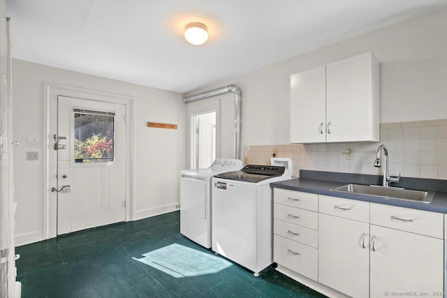 8 Academy St, New Haven, CT 06511 - laundry area featuring washing machine and clothes dryer, cabinet space, dark flooring, and baseboards