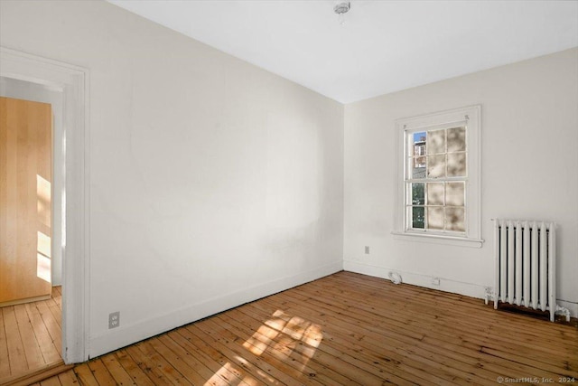 8 Academy St, New Haven, CT 06511 - unfurnished room with radiator heating unit, hardwood / wood-style flooring, and baseboards