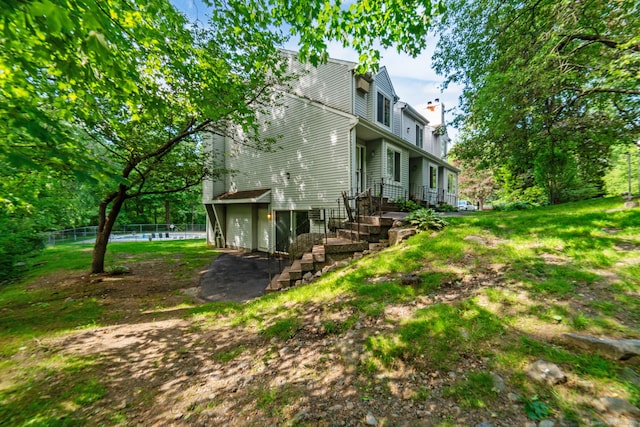 20 E Pembroke Rd Unit 55, Danbury, CT 06811 - view of home's exterior with a chimney