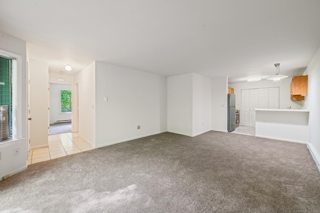 20 E Pembroke Rd Unit 55, Danbury, CT 06811 - unfurnished living room with light carpet, baseboards, light tile patterned flooring, and baseboard heating