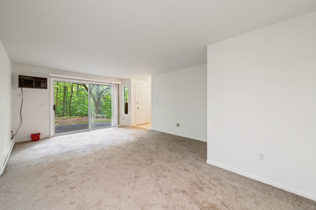 20 E Pembroke Rd Unit 55, Danbury, CT 06811 - empty room with carpet floors, baseboards, and a wall mounted AC