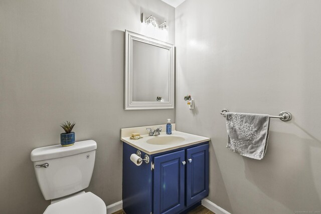 96 Flanders River Rd, Coventry, CT 06238 - bathroom featuring toilet, vanity, and baseboards