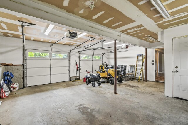 96 Flanders River Rd, Coventry, CT 06238 - garage featuring a garage door opener