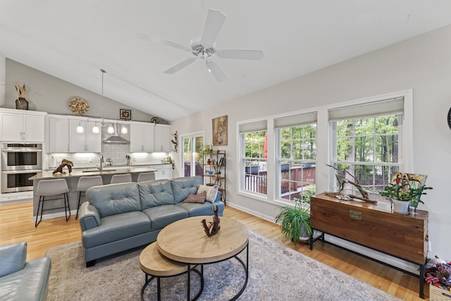 403 Mulligan Dr Unit 403, Oxford, CT 06478 - living area featuring lofted ceiling, light wood finished floors, and ceiling fan