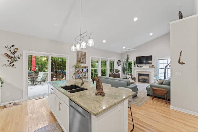403 Mulligan Dr Unit 403, Oxford, CT 06478 - kitchen with dishwasher, a sink, light wood finished floors, white cabinetry, and an island with sink