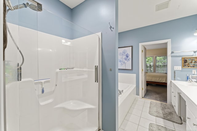 403 Mulligan Dr Unit 403, Oxford, CT 06478 - ensuite bathroom featuring a stall shower, vanity, a garden tub, and tile patterned floors